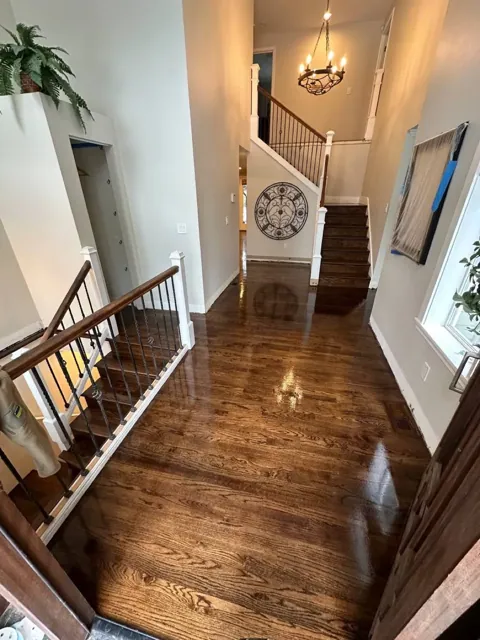 Dark-stained hardwood floor refinished in a Seattle home