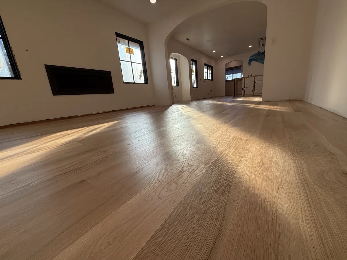 Wide-plank light oak hardwood floor in a Seattle home