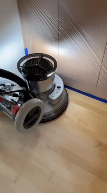 Dustless floor sanding machine with dust containment in a Seattle home