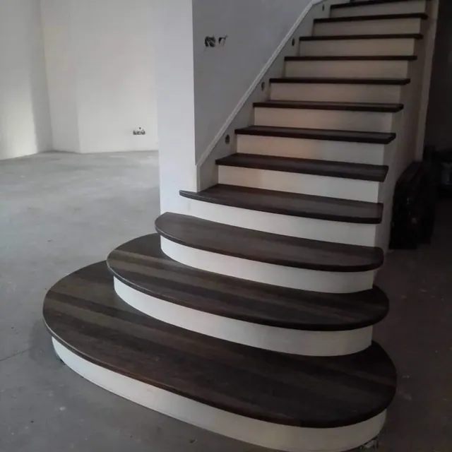 Curved walnut staircase
