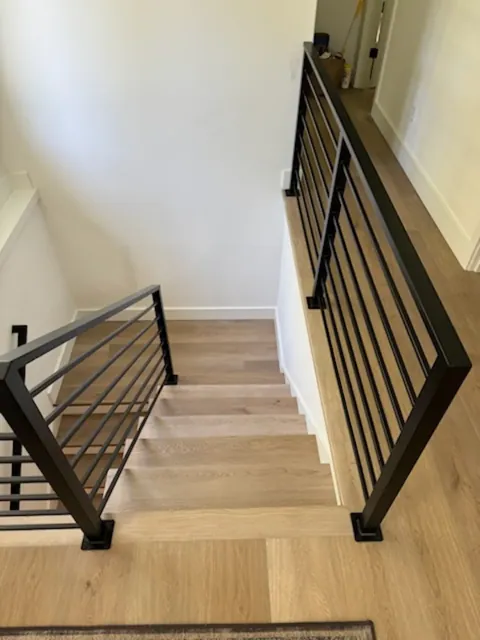 Black metal stair railing in a Seattle home